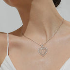111 infinity heart necklace worn on the neck with a clear CZ stone-lined inner heart