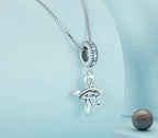 Angled view of the 925 sterling silver ankh necklace with Eye of Horus and blue stone details