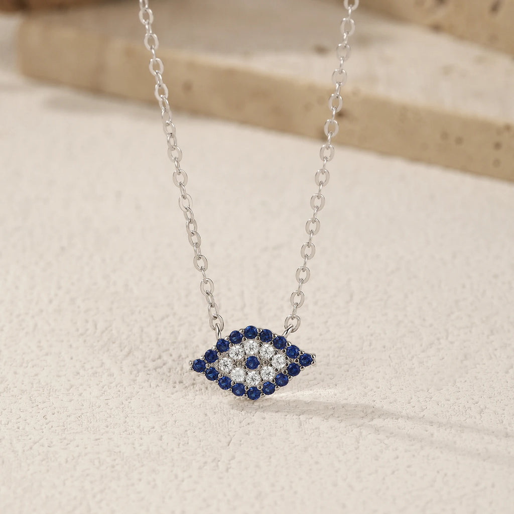 Close-up of the 925 sterling silver evil eye necklace with dark blue, clear and blue CZ stones