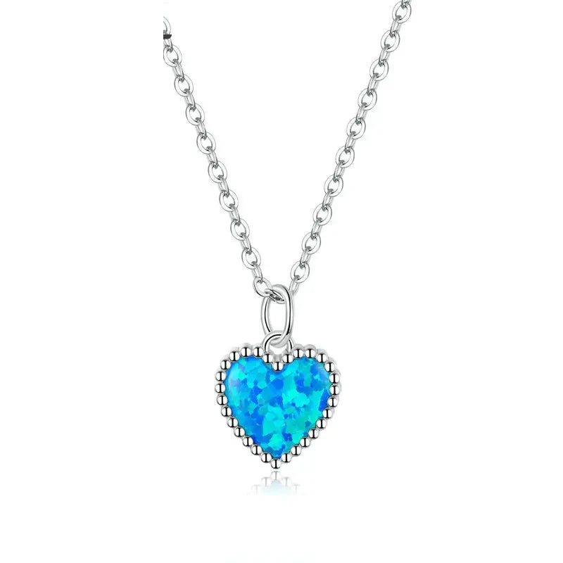 Blue heart necklace in platinum-plated 925 sterling silver with a beaded border and oval-link chain