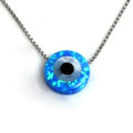 Blue synthetic opal evil eye pendant on a box chain against a white background