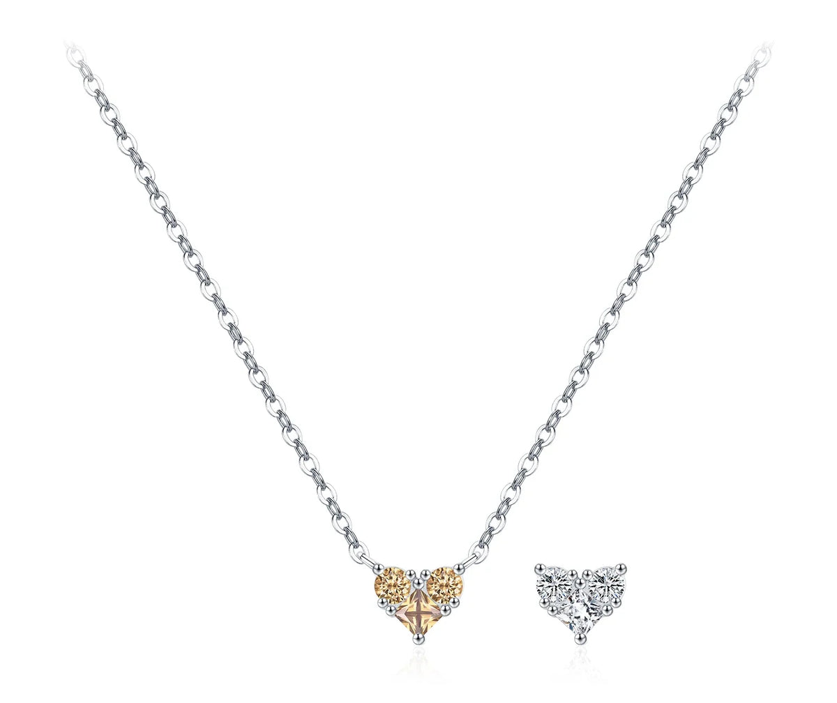 Champagne-gold CZ heart necklace with two round stones on a silver chain