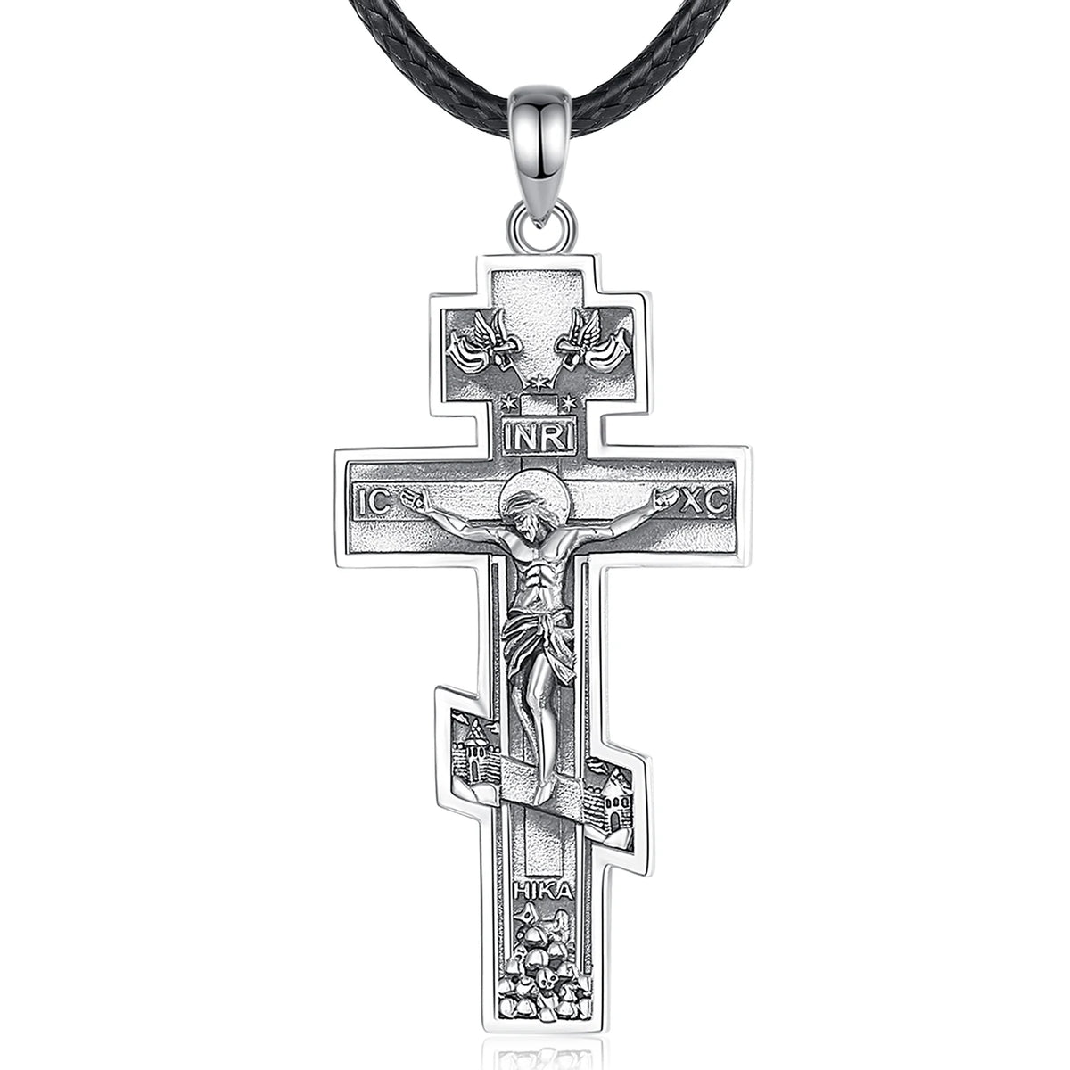 Sterling silver crucifix pendant displayed on a black braided cord with raised Christ figure