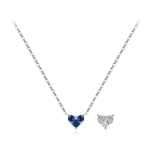 Dark blue CZ heart necklace on a fine silver chain beside a clear heart motif