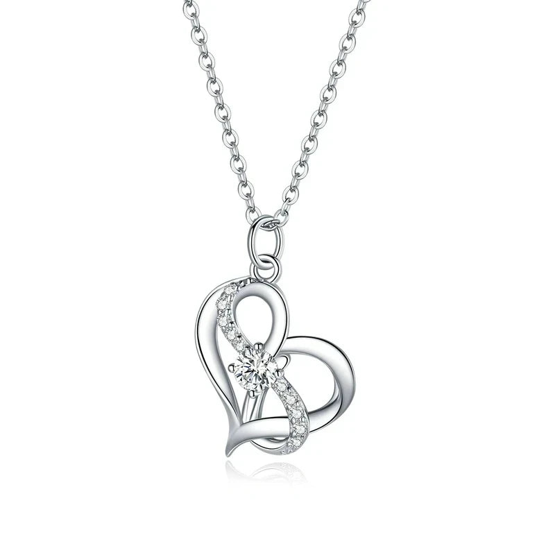 Double heart necklace in platinum-plated 925 sterling silver with clear CZ stones on a white background