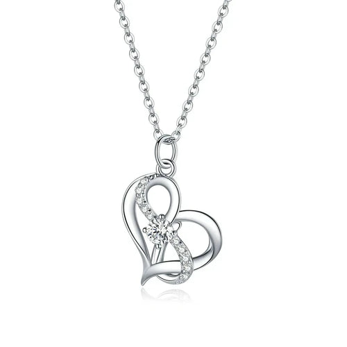 Double heart necklace in platinum-plated 925 sterling silver with clear CZ stones on a white background