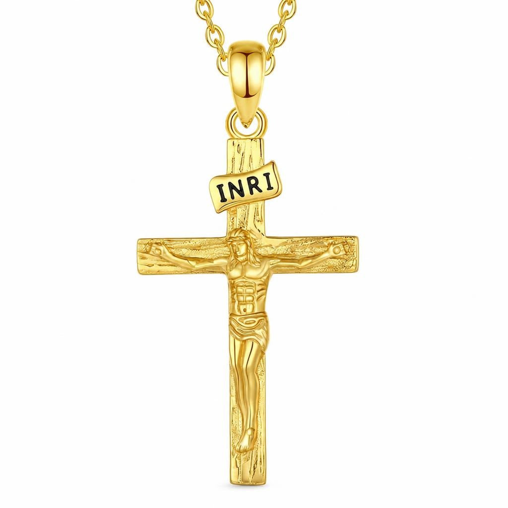 Gold crucifix necklace with INRI plaque and raised Christ figure on a white background