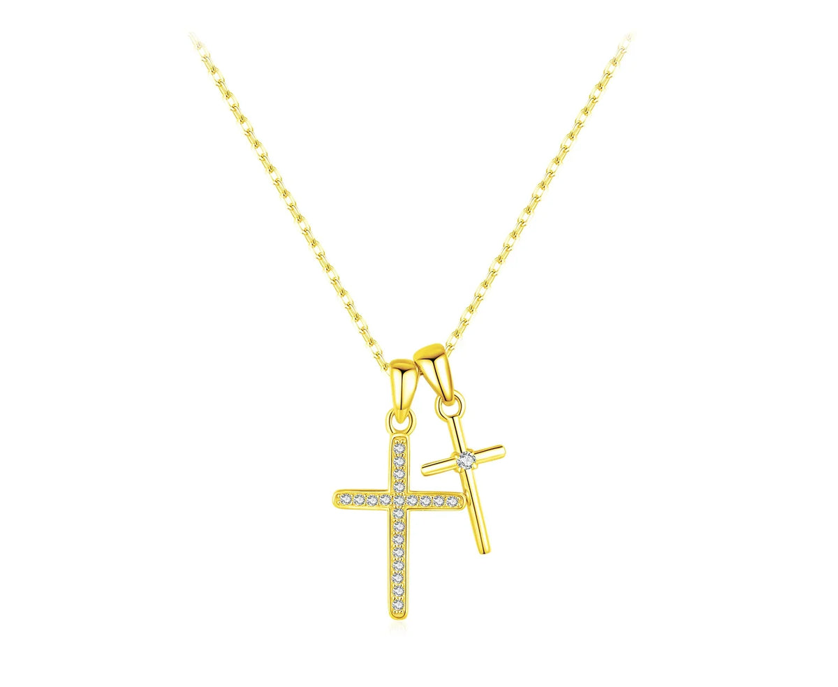 Gold-tone double cross necklace with a CZ-lined larger cross and a smaller center-stone cross