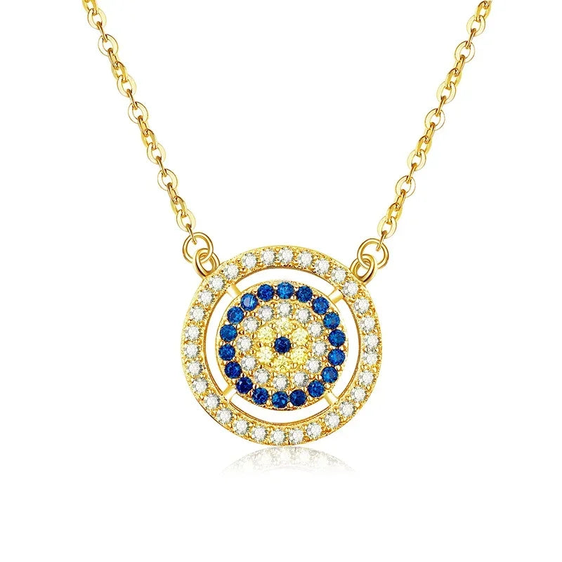 Gold-tone double halo evil eye necklace with clear outer stones, deep-blue inner ring and mixed center