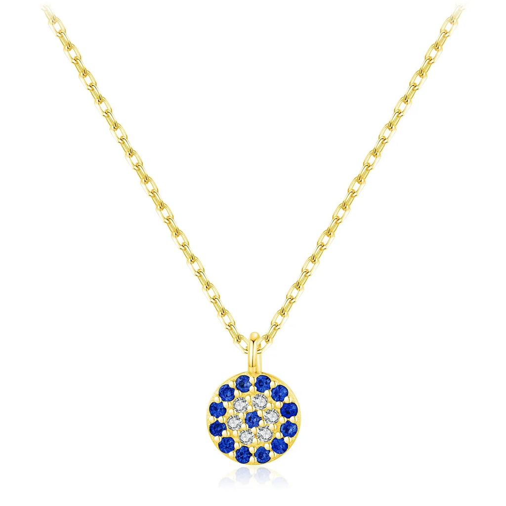 Gold-tone crystal evil eye necklace with a round pendant of blue and clear stones on a white background