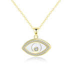 Gold-tone evil eye necklace with a polished inner outline and clear CZ stone border on white