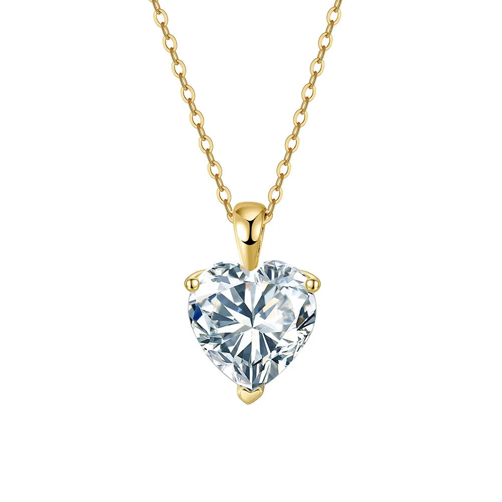 Gold-tone heart cut moissanite necklace with three-point setting on a white background