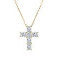Gold-tone moissanite cross necklace with six clear stones and corner prongs on a white background