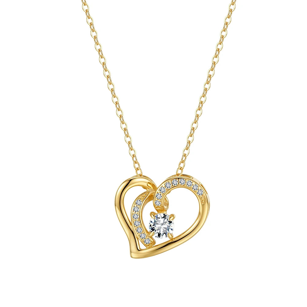 Gold-tone overlapping heart necklace with polished curves, clear accent stones, and center moissanite on white