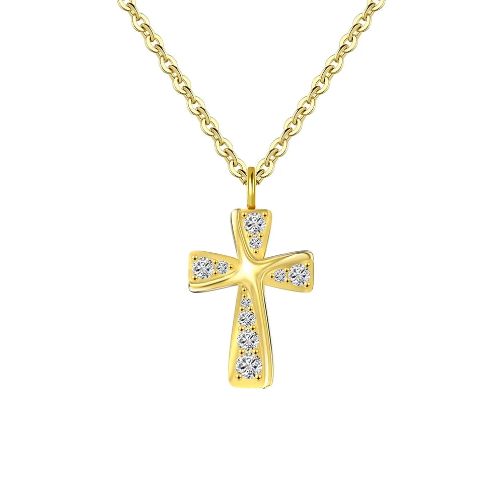 Curved gold-tone cross necklace with clear CZ stones and raised center ridge on white