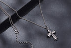Back view of the Gothic cross necklace with a lobster clasp and extender chain on dark background
