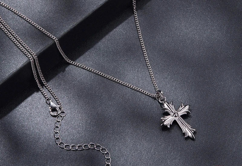 Back view of the Gothic cross necklace with a lobster clasp and extender chain on dark background