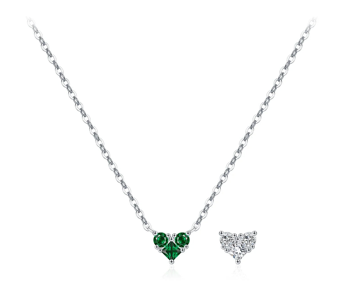 Green CZ heart necklace with visible silver prongs and a fine oval-link chain