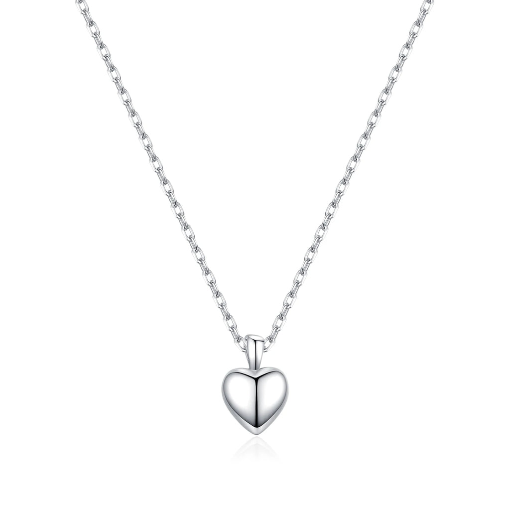 Front view of the polished puffy heart necklace with center groove on a white background