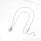 Silver-Tone evil eye hamsa necklace laid flat, showing the oval-link chain, clasp, and extender