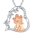 Heart family necklace with an oval-link chain, clear CZ accents, and a curling vine along the left side