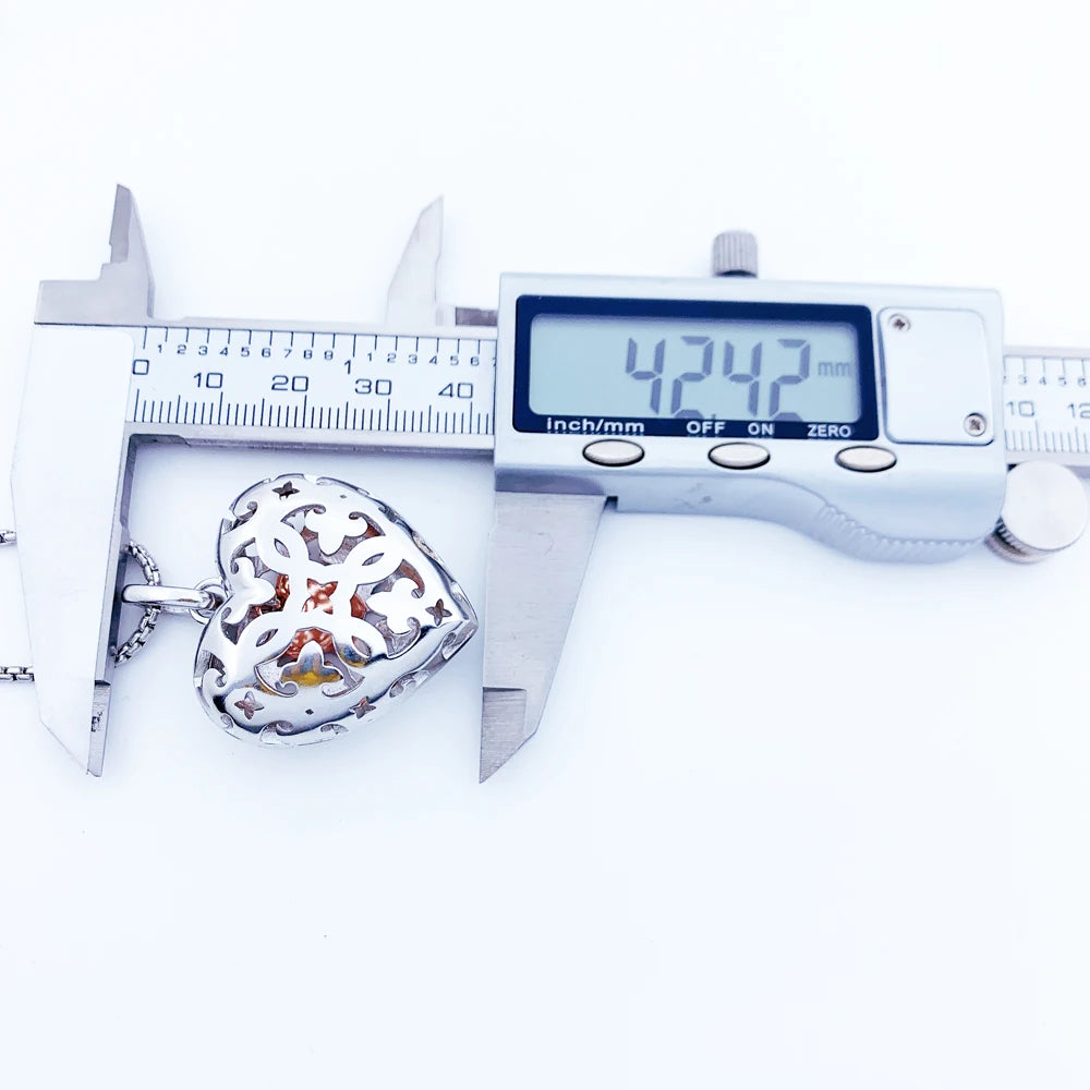 Caliper measuring the 925 sterling silver heart locket height at 1.67 in (4.2 cm)