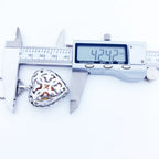 Caliper measuring the 925 sterling silver heart locket height at 1.67 in (4.2 cm)