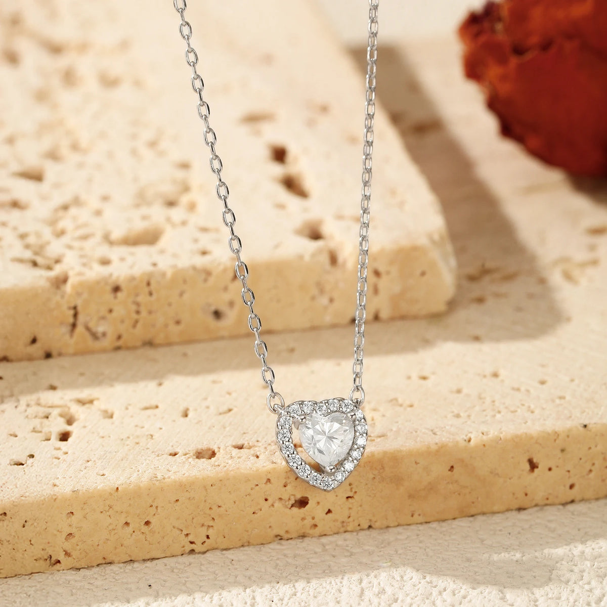 Close-up of the 925 sterling silver heart necklace with a prong-set moissanite center stone