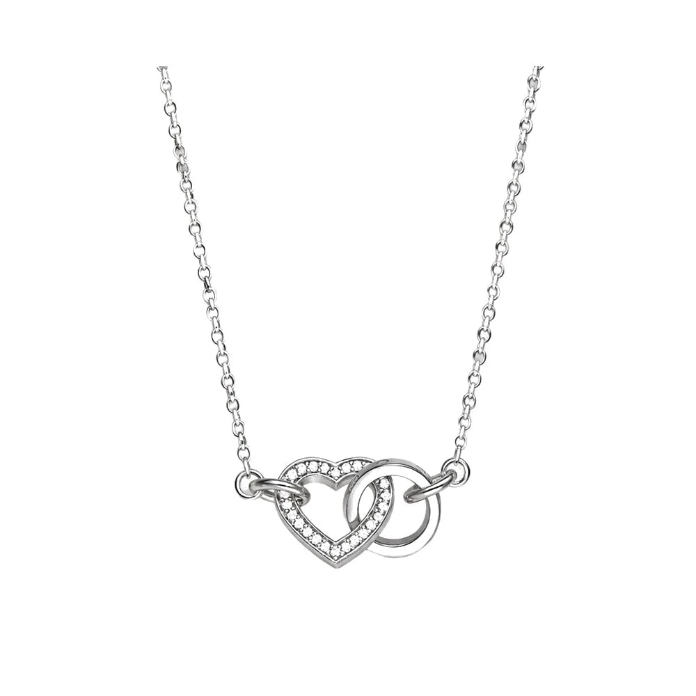 Heart and ring necklace with a CZ-set heart linked to a polished circle on a white background