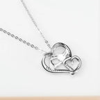 Back view of the 925 sterling silver heart pendant showing its openwork design and S925 hallmark