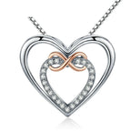 Infinity heart necklace with a polished silver-colored outer heart, CZ inner heart, and rose-gold-colored loop