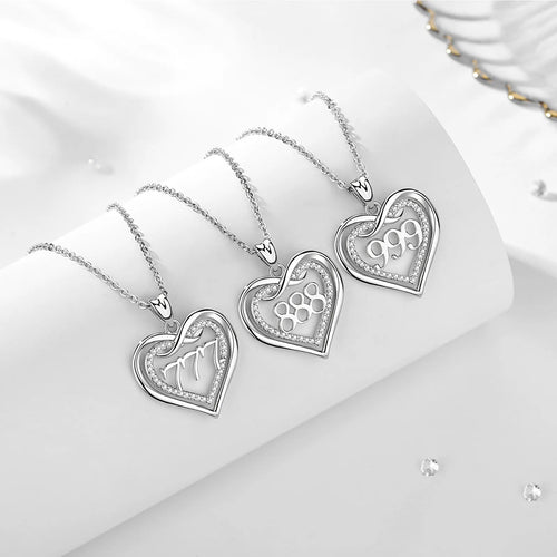 Silver 777, 888, and 999 open heart pendants with infinity symbols and clear CZ stone borders