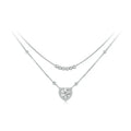 Layered heart necklace in 925 sterling silver with bead strands and a moissanite heart on white
