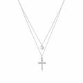 Layered Silver Cross Necklace with Heart Pendant on a plain white background