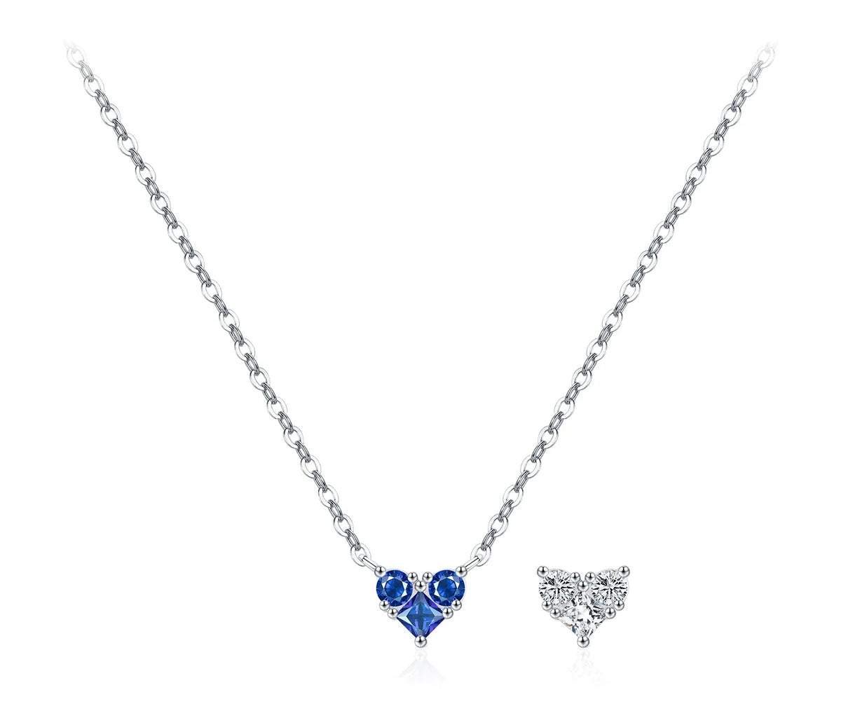 Medium blue CZ heart necklace with two round accent stones and a silver chain