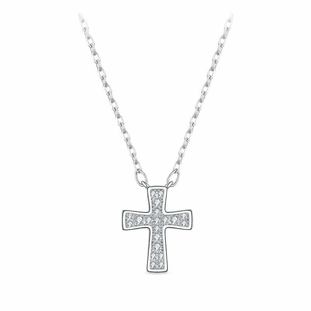 Minimalist silver cross necklace with moissanite stones on an oval-link chain against white