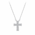 Minimalist silver cross necklace with moissanite stones on an oval-link chain against white