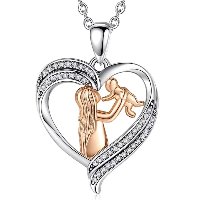 New mom heart necklace with a rose-gold-colored mother lifting her baby inside a CZ-set silver heart