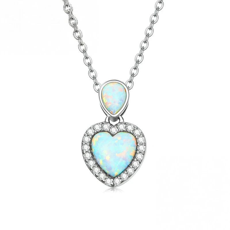 Opal-look heart necklace in 925 sterling silver with a pale-blue center and CZ stone border