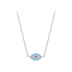 Pave evil eye necklace in 925 sterling silver with blue stones and a black center on white