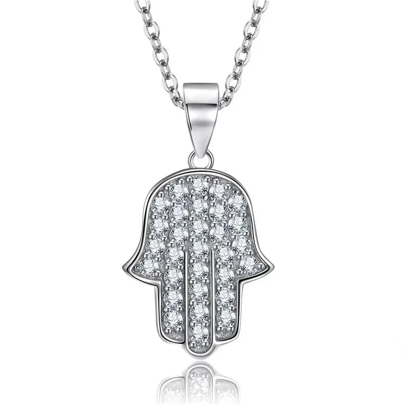 Pave Hamsa hand necklace in 925 sterling silver with clear CZ rows and a polished rim on white background