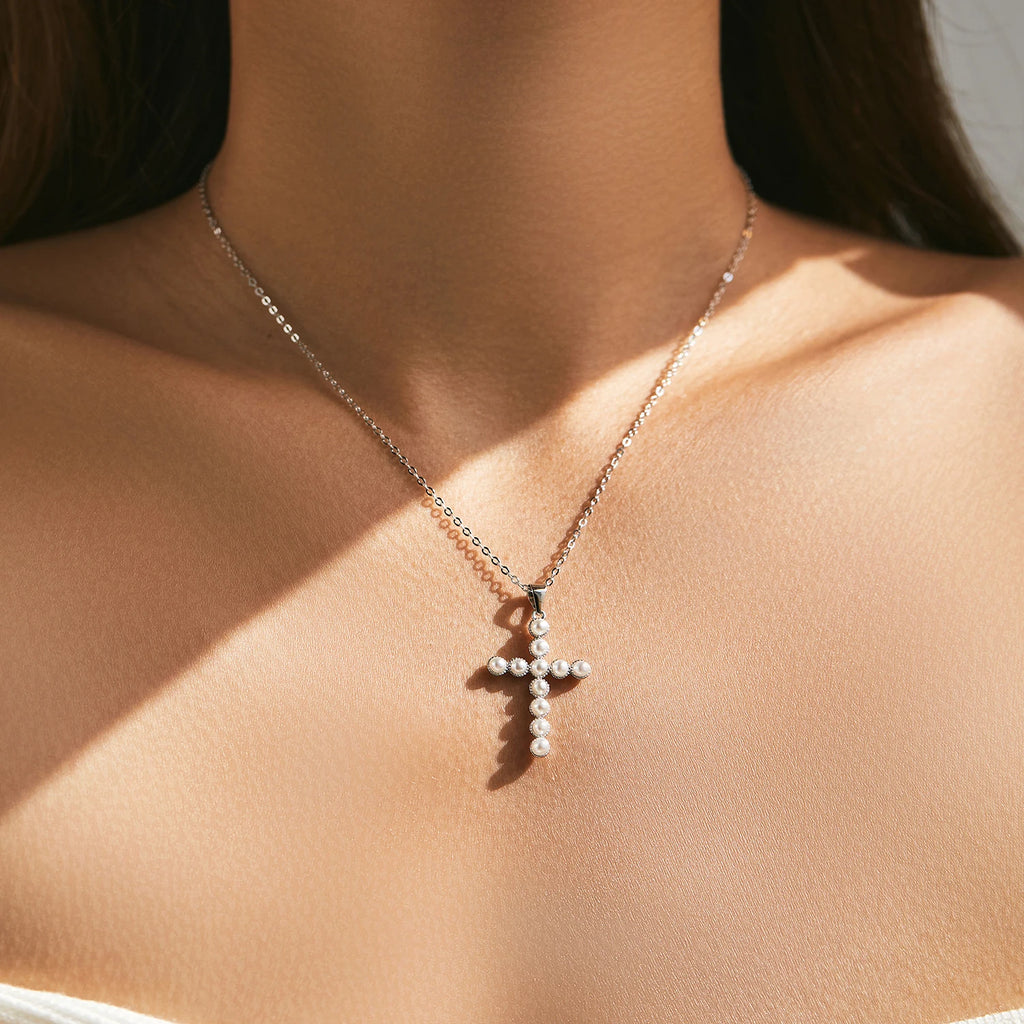 925 sterling silver pearl cross necklace worn at the collarbone on a fine oval-link chain