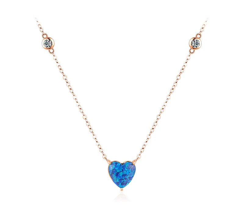 Rose gold-tone blue heart necklace with two clear crystals set along the chain