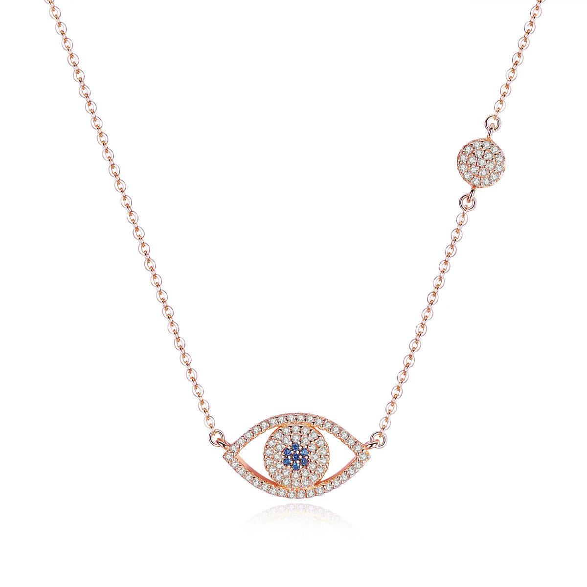 Rose gold-tone evil eye necklace on white with blue CZ center, clear CZ outline, and side station