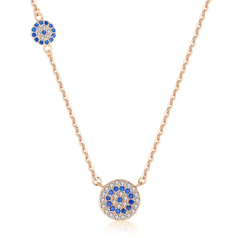 Rose gold-tone evil eye necklace with two round blue and clear cubic zirconia eye accents