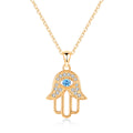 Rose Gold-Tone evil eye hamsa hand necklace with clear CZ accents and beaded borders on white