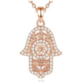 Rose gold hamsa hand necklace with Star of David, filigree and clear CZ stones on white