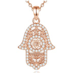 Rose gold hamsa hand necklace with Star of David, filigree and clear CZ stones on white
