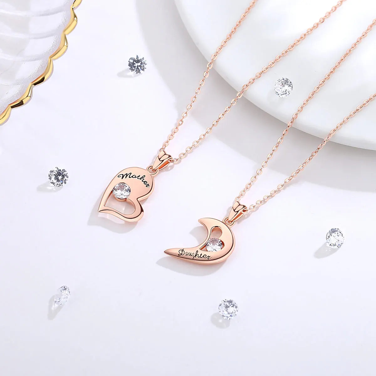 Rose gold-tone Mother heart and Daughter crescent necklaces with clear crystal stones