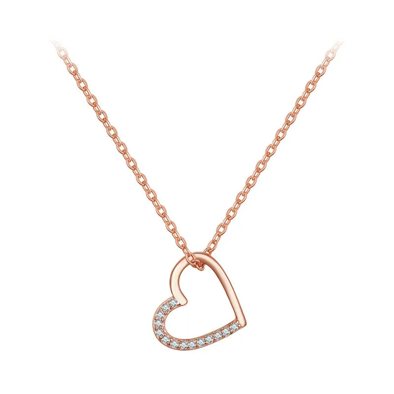 Rose gold-tone asymmetrical open heart necklace with clear CZ stones against a white background